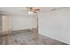 Open concept living area with tiled floors and access to other rooms at 3403 Overland Dr, Holiday, FL 34691