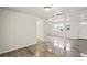 Open living area with tiled floors and access to other rooms at 3403 Overland Dr, Holiday, FL 34691