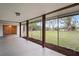 Relaxing screened patio overlooking a lush green backyard at 3403 Overland Dr, Holiday, FL 34691