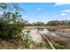 Peaceful waterfront view with lush greenery and calm water at 3403 Overland Dr, Holiday, FL 34691