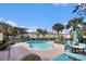 Refreshing community pool with surrounding patio furniture at 3875 Mariner Dr, St Petersburg, FL 33705