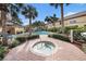 Community hot tub area with surrounding landscaping at 3875 Mariner Dr, St Petersburg, FL 33705