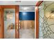 Home entryway with exposed framing and new flooring at 3939 Venetian Way, Tampa, FL 33634
