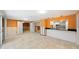 Gathering room with kitchen view and sliding glass doors at 3939 Venetian Way, Tampa, FL 33634