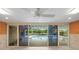Gathering room with sliding doors opening to a pool at 3939 Venetian Way, Tampa, FL 33634