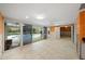 Gathering room with view of pool and sliding glass doors at 3939 Venetian Way, Tampa, FL 33634