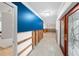 Hallway with exposed framing and new flooring at 3939 Venetian Way, Tampa, FL 33634