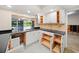 Kitchen with pool view and black countertops at 3939 Venetian Way, Tampa, FL 33634