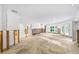 Renovation in progress, showing a large living room with water damage and exposed walls at 3939 Venetian Way, Tampa, FL 33634