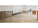 Living room undergoing renovation, with exposed framing and new flooring at 3939 Venetian Way, Tampa, FL 33634