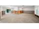Living room undergoing renovation, with exposed framing and new flooring at 3939 Venetian Way, Tampa, FL 33634