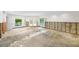Living room with damaged flooring, under renovation at 3939 Venetian Way, Tampa, FL 33634