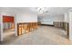 Main bedroom undergoing renovation, with exposed framing and new flooring at 3939 Venetian Way, Tampa, FL 33634