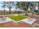 Two park benches surrounding a small patch of grass at 3939 Venetian Way, Tampa, FL 33634