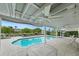 Inviting pool area with patio furniture under covered cabana at 3939 Venetian Way, Tampa, FL 33634