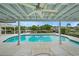 Large kidney-shaped pool with patio and canal view at 3939 Venetian Way, Tampa, FL 33634