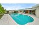 Inviting swimming pool with a large patio area at 3939 Venetian Way, Tampa, FL 33634
