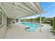 Stunning pool and spa with covered patio and canal view at 3939 Venetian Way, Tampa, FL 33634