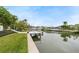 Landscaped waterfront property with private dock access at 3939 Venetian Way, Tampa, FL 33634