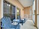 Enjoy this peaceful balcony with comfortable seating at 4178 Des Prez Ct, Hernando Beach, FL 34607