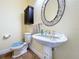 Elegant bathroom with pedestal sink and floral motif at 4178 Des Prez Ct, Hernando Beach, FL 34607