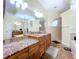 Elegant bathroom features double sinks, granite counters, and ample storage at 4178 Des Prez Ct, Hernando Beach, FL 34607