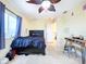 Bedroom with a queen bed, ceiling fan, and built-in desk area at 4178 Des Prez Ct, Hernando Beach, FL 34607