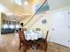 Casual dining area with round table and chairs near staircase at 4178 Des Prez Ct, Hernando Beach, FL 34607