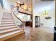 Elegant dining room with tile floors and a view of the open staircase at 4178 Des Prez Ct, Hernando Beach, FL 34607