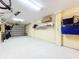 Organized garage featuring shelving and storage solutions for various items at 4178 Des Prez Ct, Hernando Beach, FL 34607