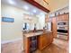 Island kitchen with stainless steel appliances and granite countertops at 4178 Des Prez Ct, Hernando Beach, FL 34607