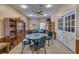 Community room with tables, chairs, and bookcases at 4215 E Bay Dr # 1702A, Clearwater, FL 33764