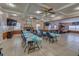 Spacious community room with tables and a fireplace at 4215 E Bay Dr # 1702A, Clearwater, FL 33764