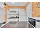 Kitchen boasts granite countertops and white cabinetry at 4215 E Bay Dr # 1702A, Clearwater, FL 33764