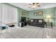 Living room with black leather couch and dining area at 4215 E Bay Dr # 1702A, Clearwater, FL 33764