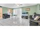 Living room with view of pool and kitchen at 4215 E Bay Dr # 1702A, Clearwater, FL 33764