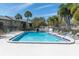 Inviting community pool with lounge chairs at 4215 E Bay Dr # 1702A, Clearwater, FL 33764