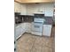 Kitchen with white cabinets and appliances at 4300 58Th N St # 2000, Kenneth City, FL 33709