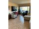 Living room with tiled floor, large window, and furniture at 4300 58Th N St # 2000, Kenneth City, FL 33709