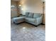 Living room with sectional sofa and floor lamp at 4300 58Th N St # 2000, Kenneth City, FL 33709
