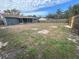 Large backyard with fenced perimeter and screened patio at 7318 Dianne Dr, New Port Richey, FL 34652