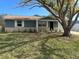 Charming single story home with gray exterior and landscaping at 7318 Dianne Dr, New Port Richey, FL 34652