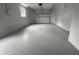 Clean and spacious garage with epoxy flooring at 7318 Dianne Dr, New Port Richey, FL 34652