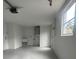 Garage with utility sink, storage, and epoxy flooring at 7318 Dianne Dr, New Port Richey, FL 34652