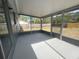 Spacious screened porch with a view of the backyard at 7318 Dianne Dr, New Port Richey, FL 34652