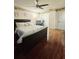 Spacious bedroom with ceiling fan, hardwood floors, and a king-size bed at 7634 Desoto Ct, Tampa, FL 33615