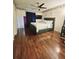 Spacious bedroom with ceiling fan, hardwood floors, and a king-size bed at 7634 Desoto Ct, Tampa, FL 33615