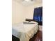 Bedroom with a double bed and dark wood floors at 7634 Desoto Ct, Tampa, FL 33615