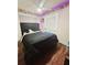 Bedroom with a queen bed and dark wood floors at 7634 Desoto Ct, Tampa, FL 33615