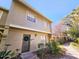 Two-story townhome with a landscaped front yard and a walkway at 7634 Desoto Ct, Tampa, FL 33615